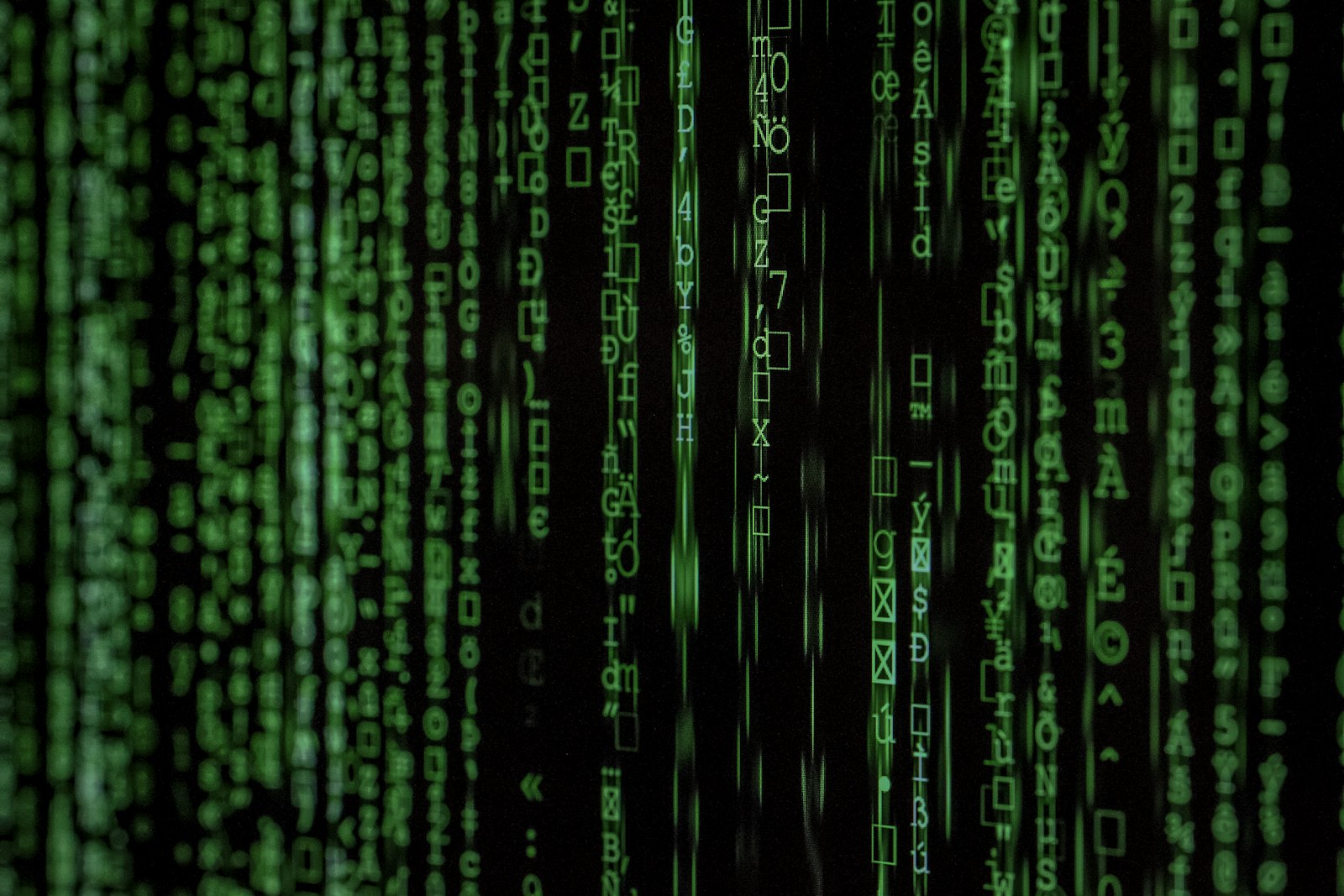 Green matrix-style code on a dark screen, evoking large language model inference and terminal-driven agents